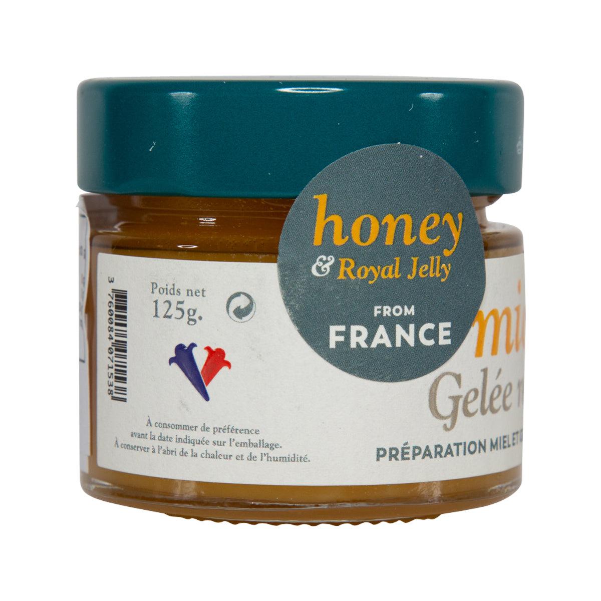 Honey and royal jelly jar with teal lid and label showing from France