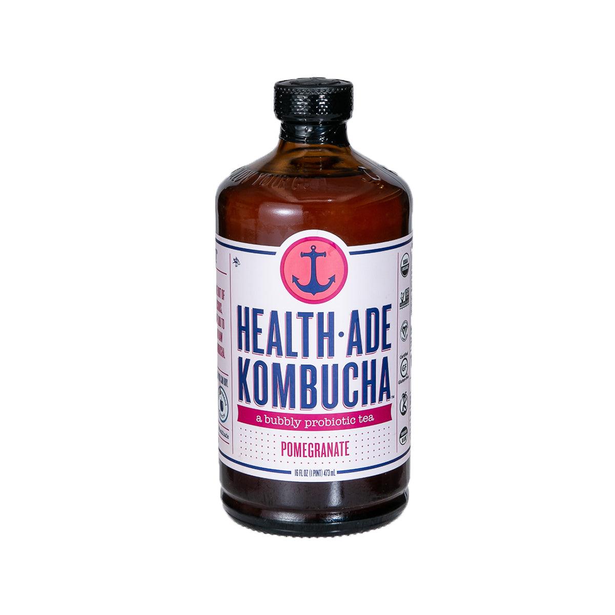 Health-Ade kombucha bottle with dark amber liquid and pomegranate label, 473 mL