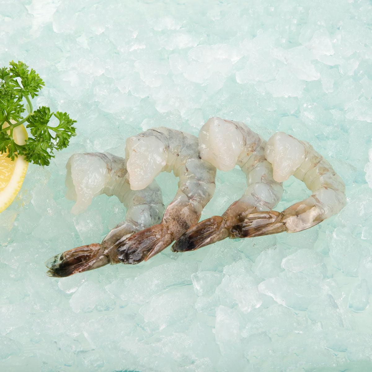 Frozen black tiger prawns with shells, tail on