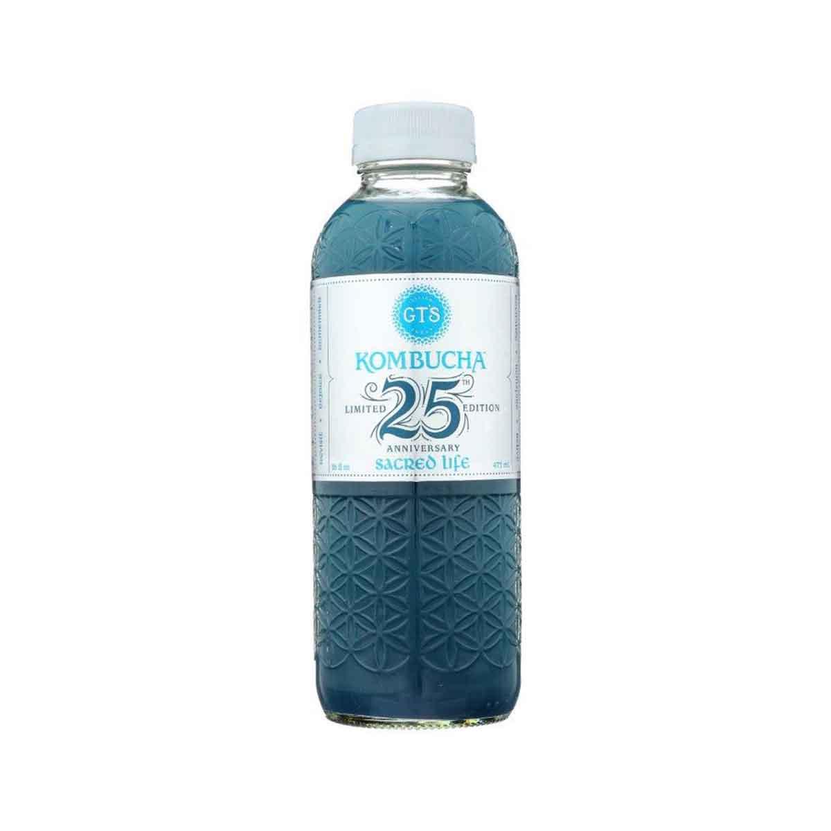 GT'S kombucha drink bottle, dark blue glass with embossed texture and white label