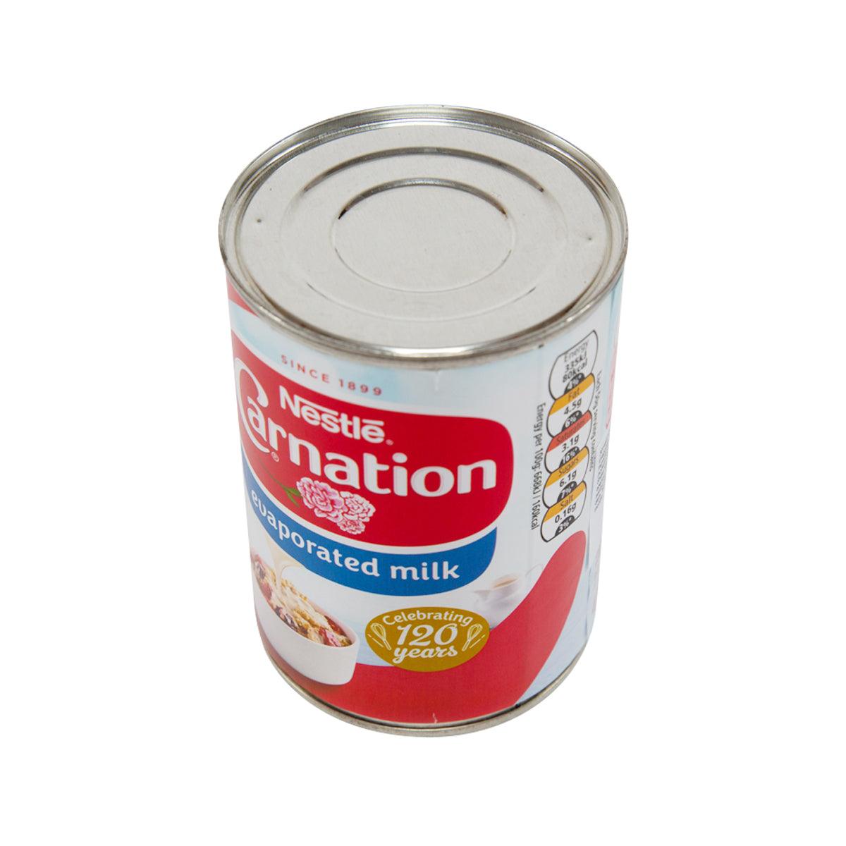 Evaporated milk can with open metal top and red-white Carnation label