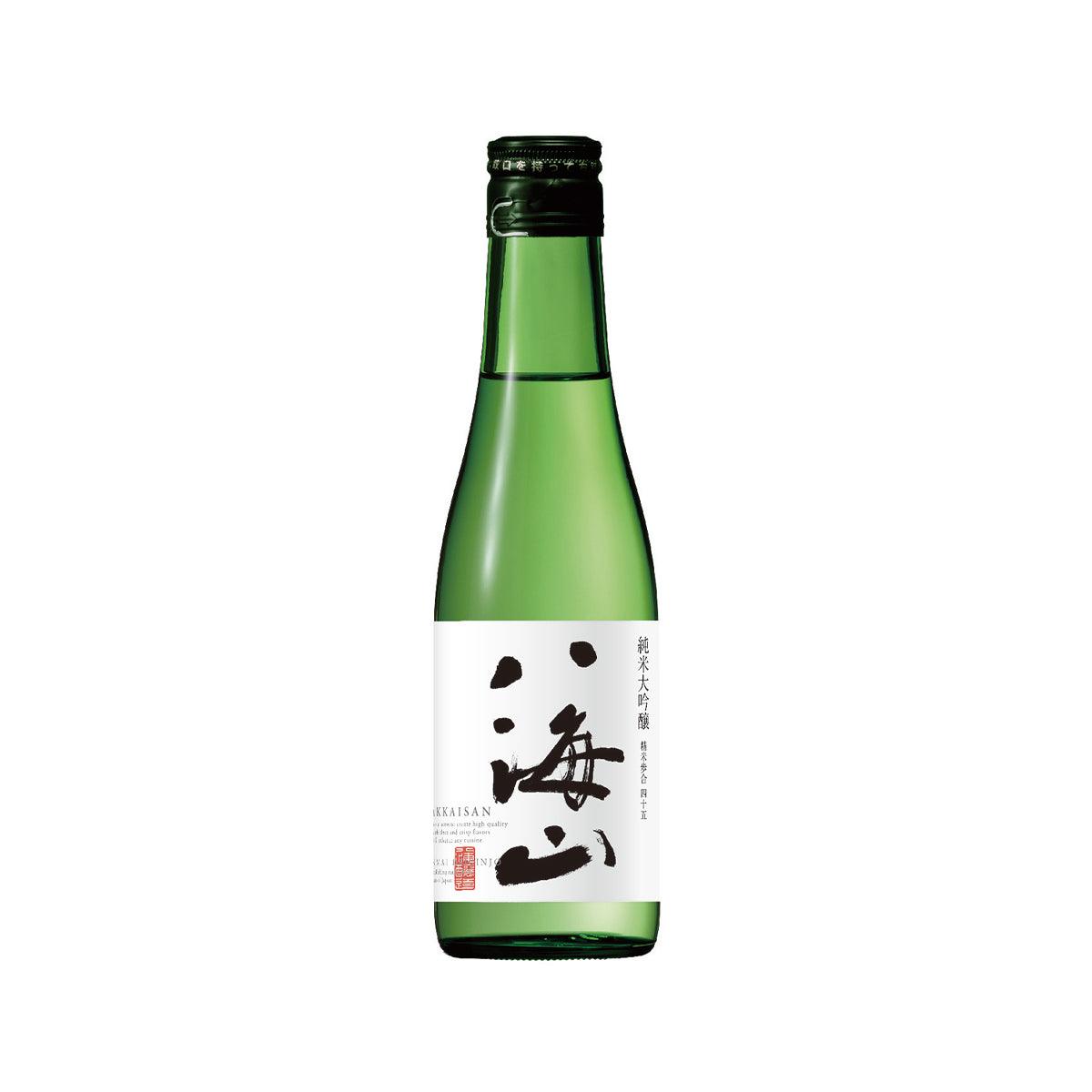 HAKKAISAN sake bottle, green glass with dark cap and white label