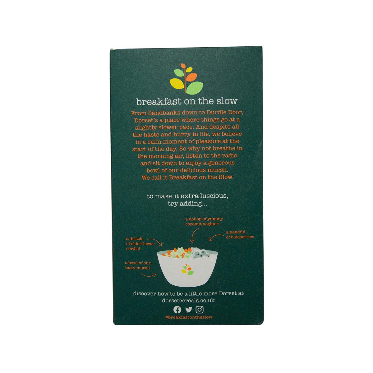 Dorset Simply Fruity Muesli cereal box back, dark green with ingredient text and bowl graphic
