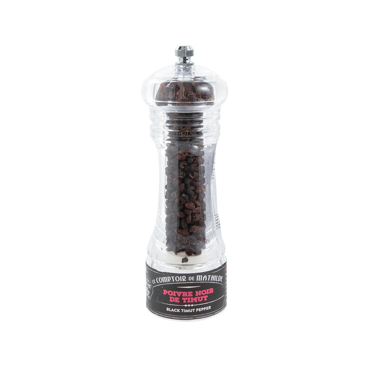 Black peppercorn grinder in clear plastic with metal top, filled with dark peppercorns