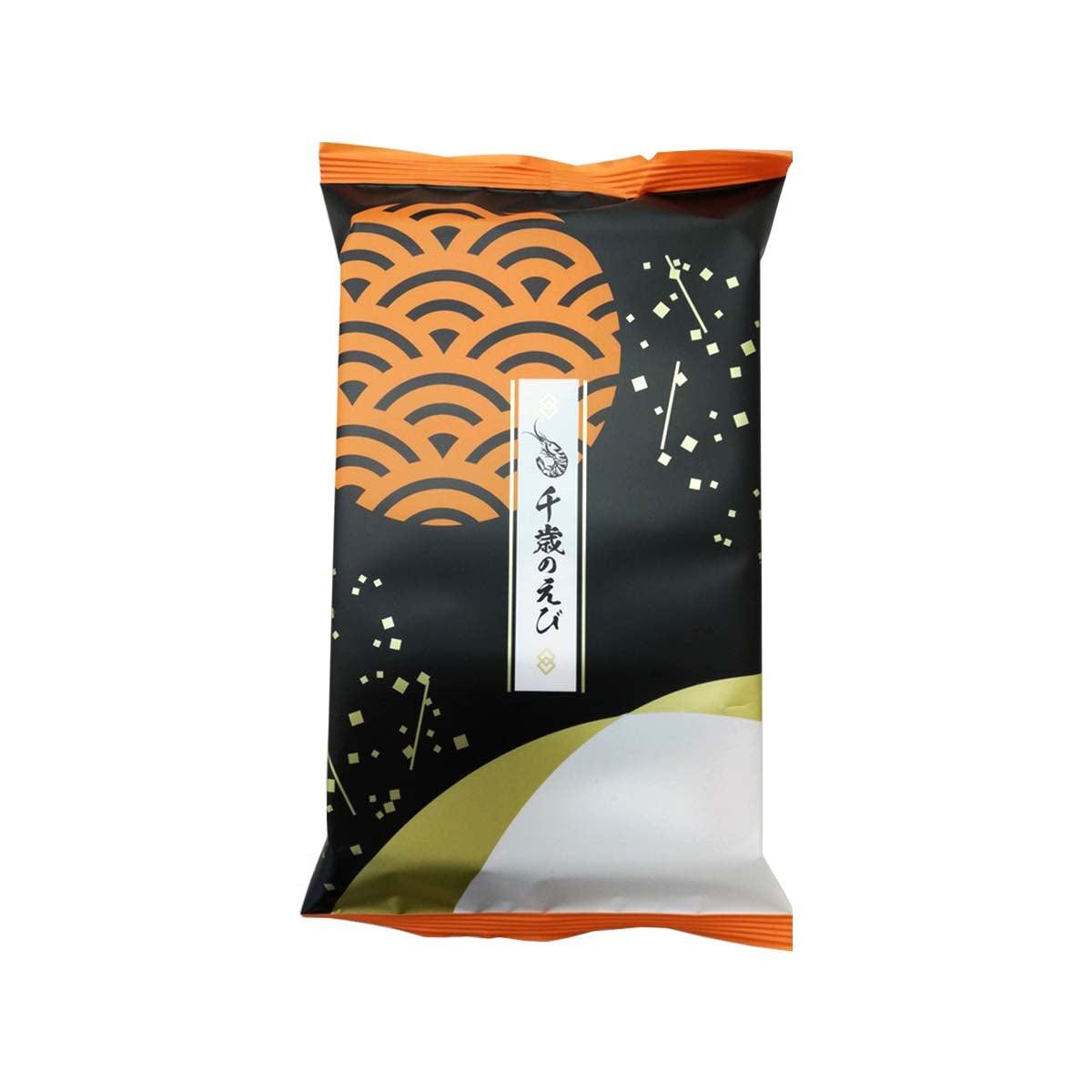 Shrimp cracker snack pack, black wrapper with orange wave pattern and white label