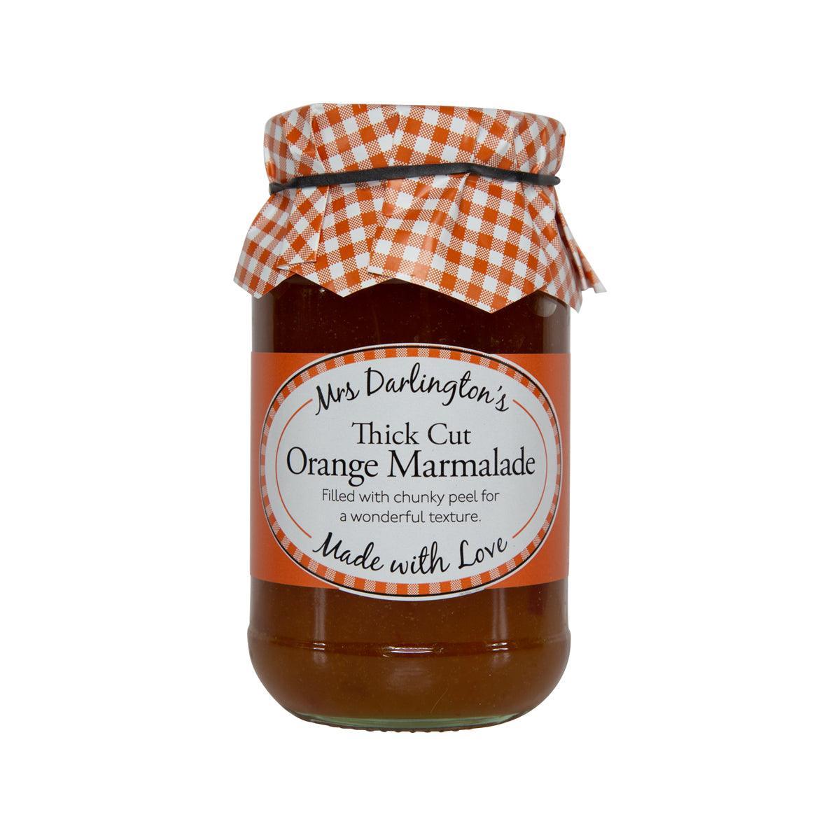 Thick cut orange marmalade jar with amber contents and gingham cloth lid