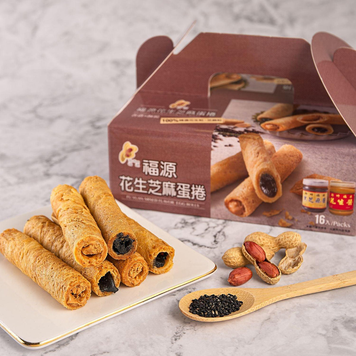 Egg roll pastries with visible filling, shown with boxed 16-piece set