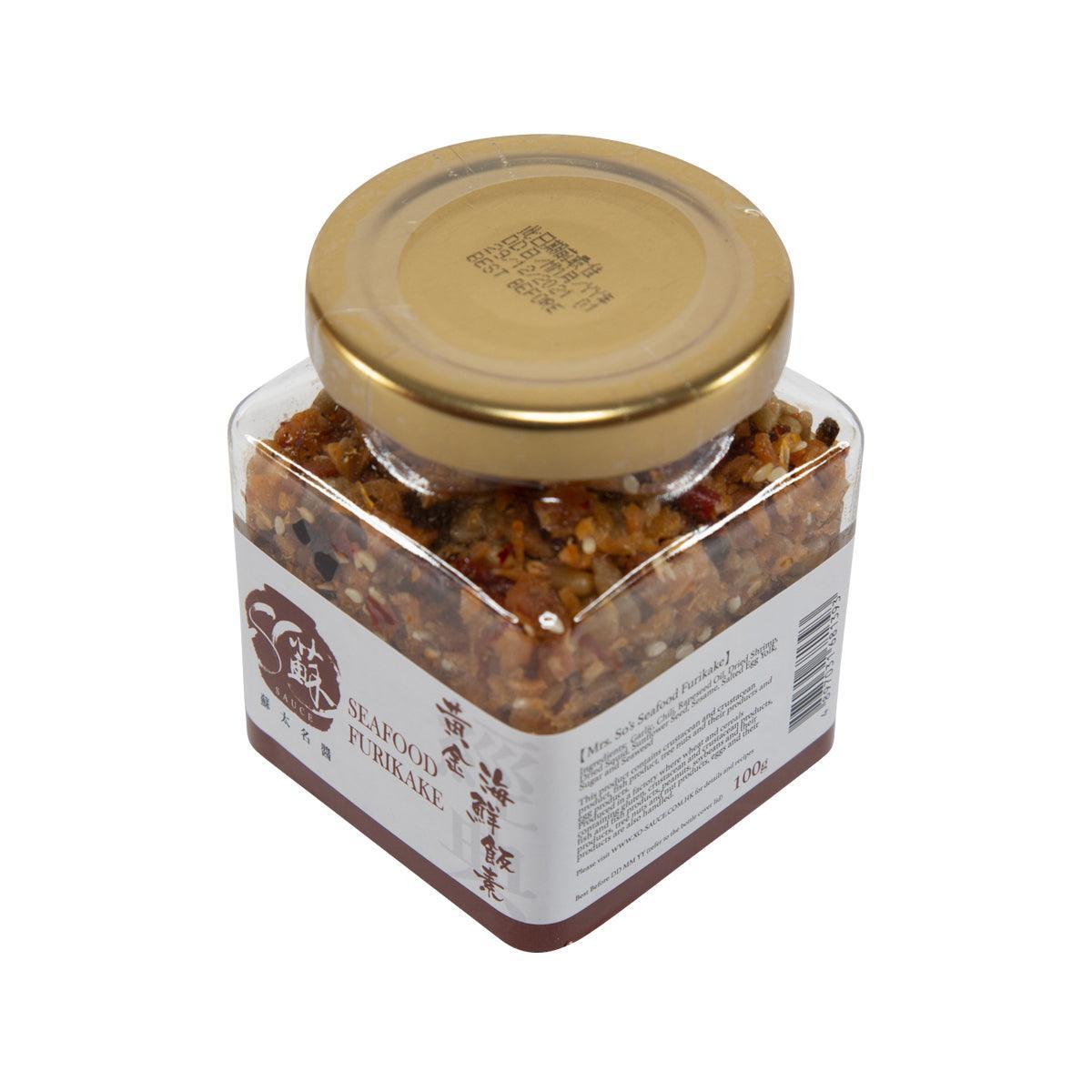 Seafood furikake sauce jar with gold lid, clear sides, and back label