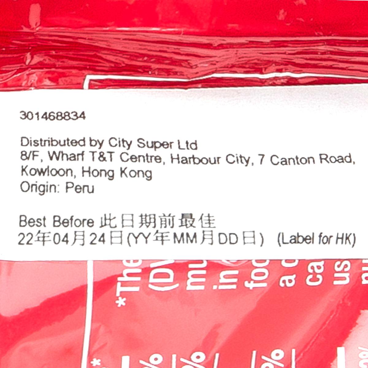 Organic chocolate pouch close-up, red label with address and best-before date