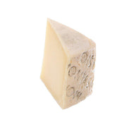 MONTASIO DOP cheese wedge with rind and stamped marks