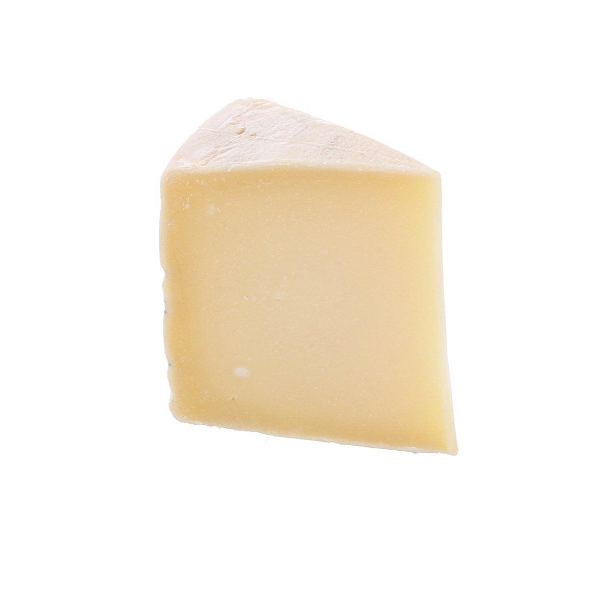MONTASIO DOP cheese wedge with smooth pale interior