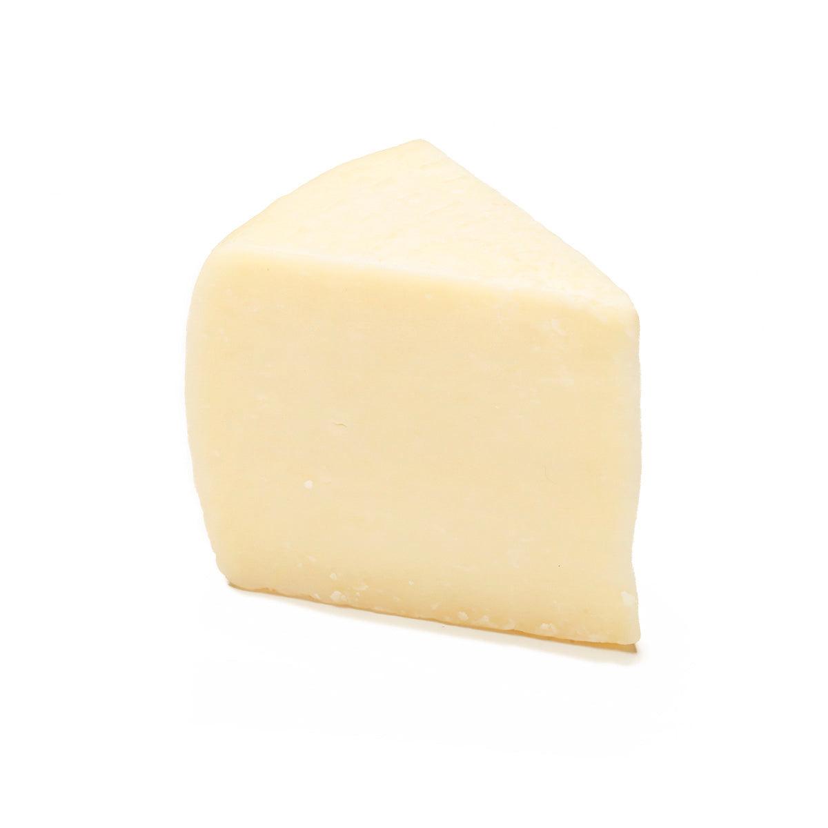 Pecorino Toscano DOP cheese wedge, pale yellow with smooth rind