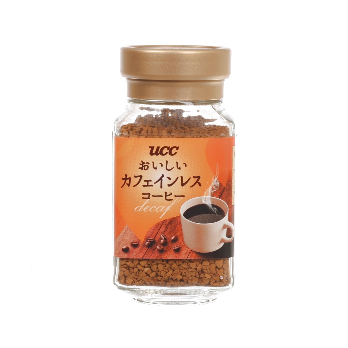 UCC decaffeinated instant coffee jar with tan lid, orange label, and coffee granules
