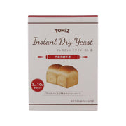 Instant dry yeast carton with TOMIZ Instant Dry Yeast branding and red accents