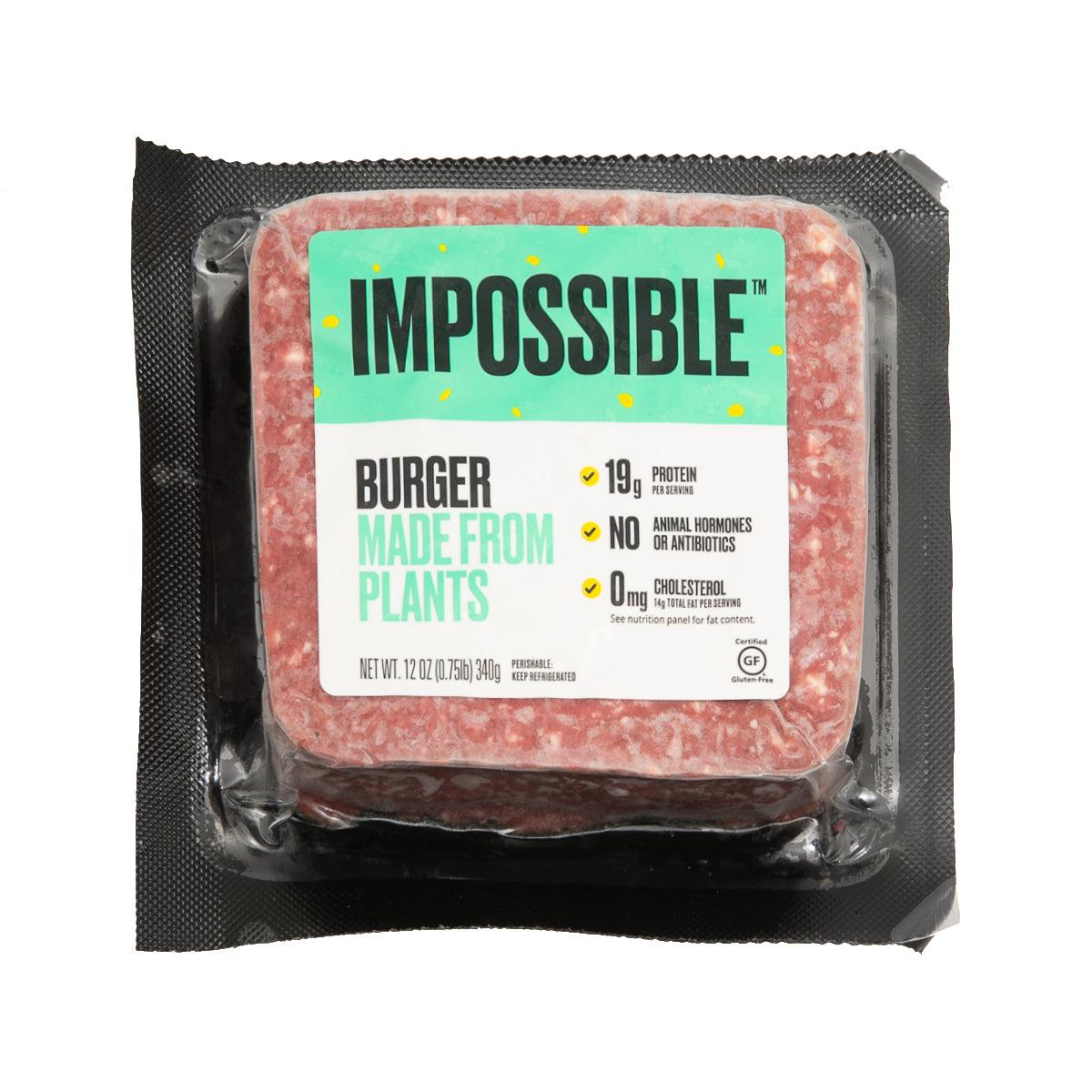 Plant-based ground beef pouch with Impossible label and burger made from plants