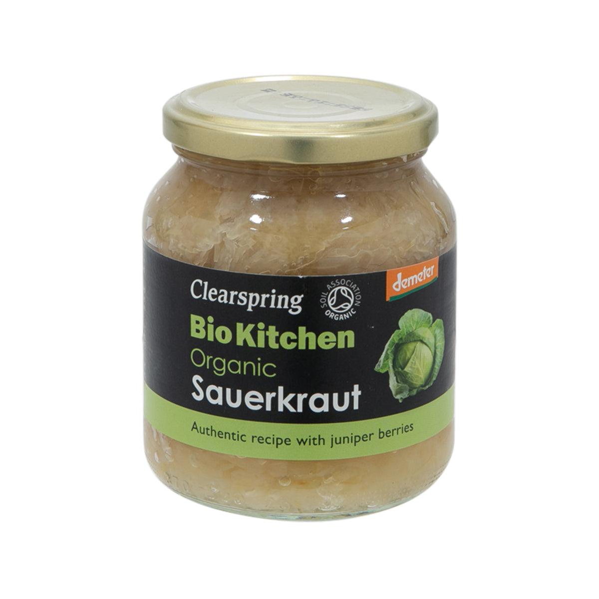 Organic sauerkraut jar with clear plastic lid, pale green cabbage, and brand label