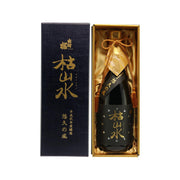 Dark glass vintage bottle with gold label, in gold gift box with ribbon tie