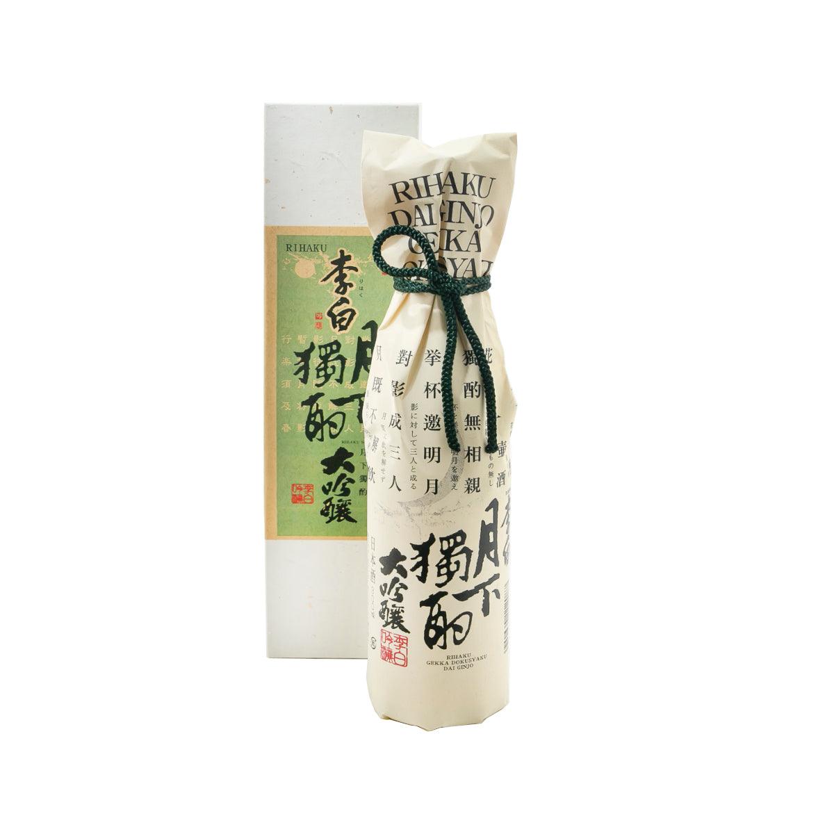 RIHAKU Daiginjo sake bottle in cream paper wrap with dark blue tied ribbon, 300 mL