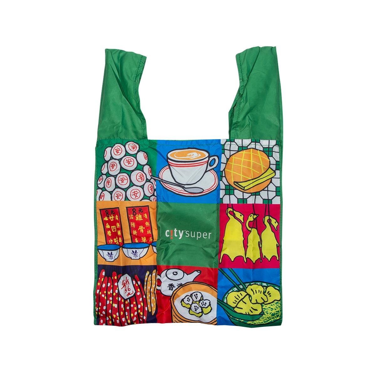 Small foldable tote bag, green handles, colorful illustrated front panel
