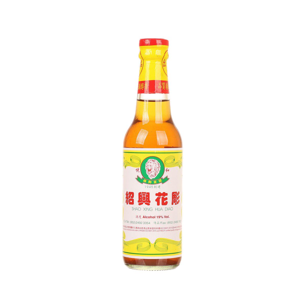 Chinese wine bottle with red cap and yellow front label