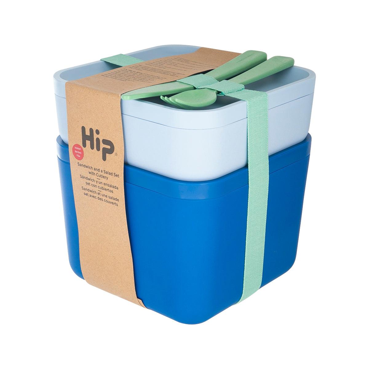 Two-tier lunch container with green utensils on top, blue and light-gray storage boxes