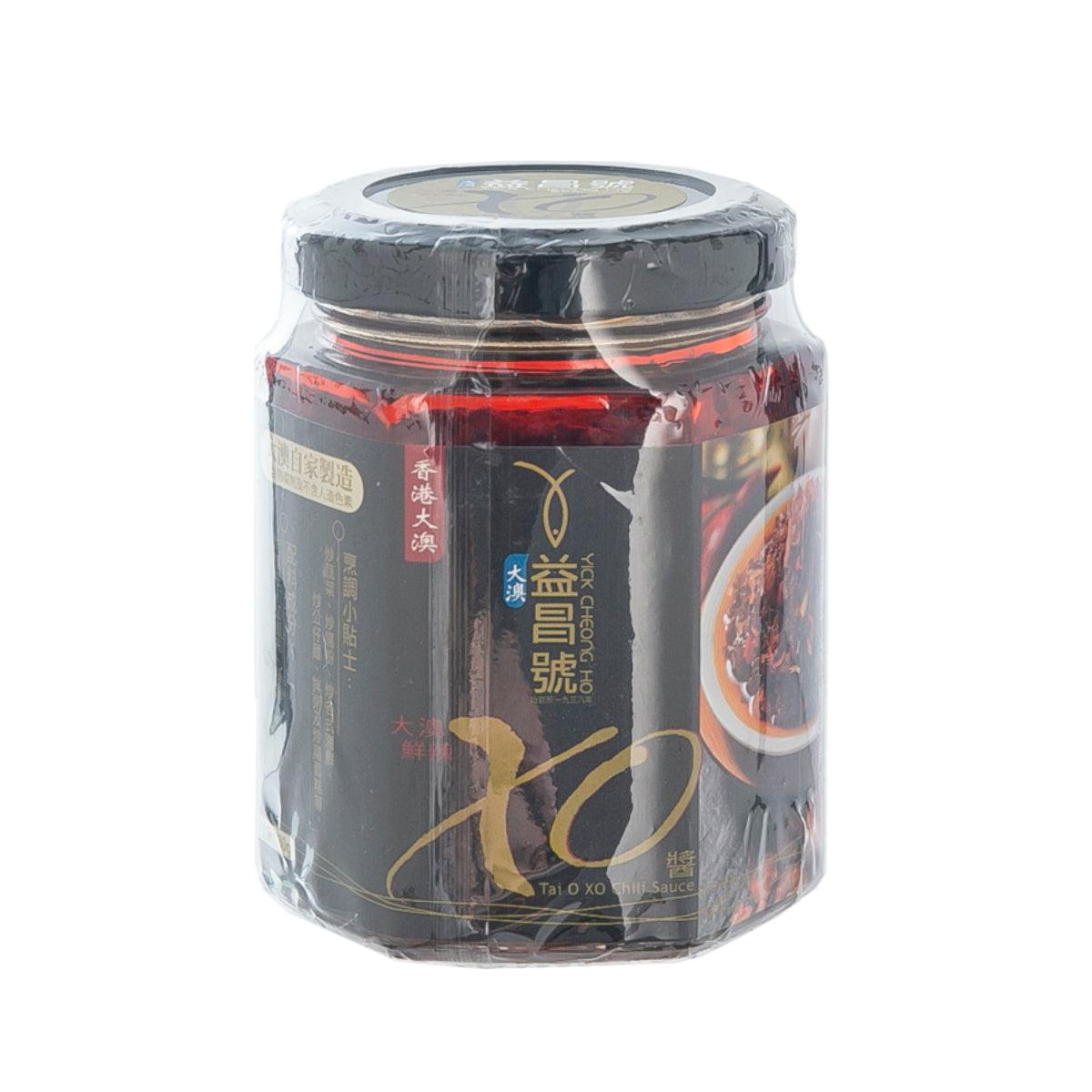 Tai O XO chili sauce jar with black lid and red chili flakes