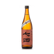 Amber sake bottle with black cap and printed paper label