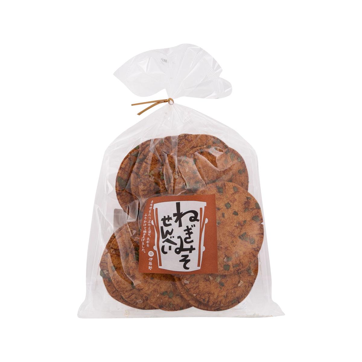 Green onion miso rice crackers in clear bag, tied, with label on front