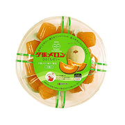 Round tray of orange one-bite jelly with green label and foil sachets