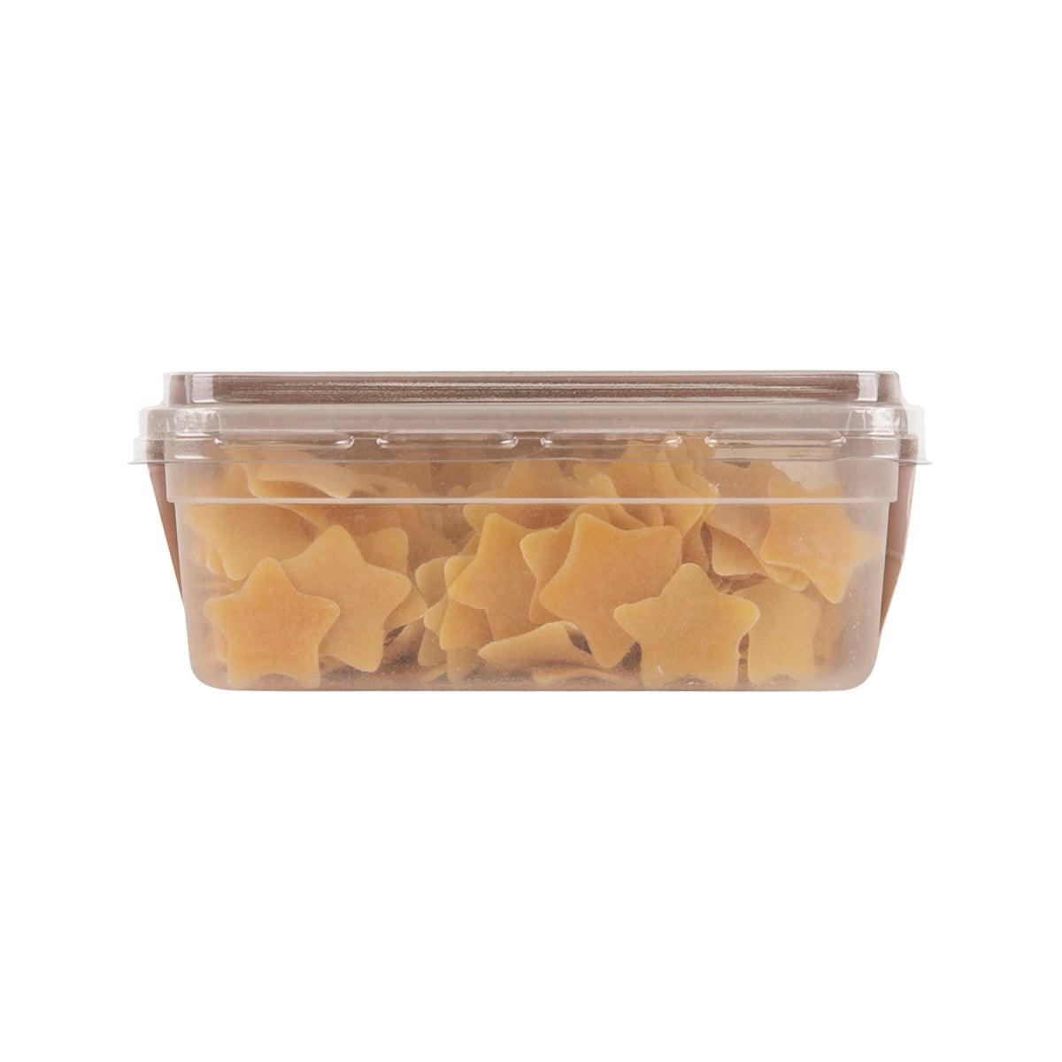Clear plastic container filled with pumpkin-colored star-shaped noodles