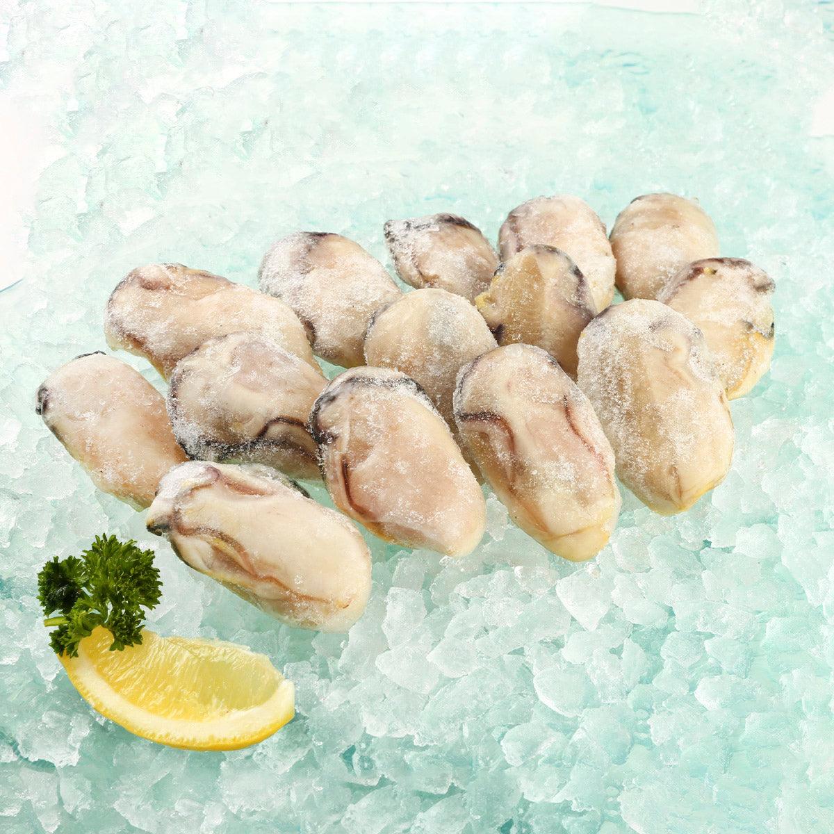 Frozen giant oyster meat pieces, beige with frost, ready for cooking