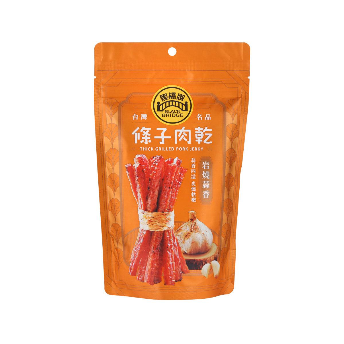 BLACK BRIDGE garlic thick grilled pork jerky pouch with red strips, front label