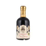 Balsamic vinegar bottle with gold cap and dark glass, front label with ornate badge