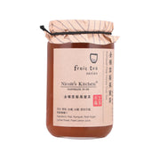 Glass fruit tea honey jar with cream label and tied fabric lid
