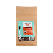 Organic whole bean coffee pouch in kraft paper with teal label and barcode