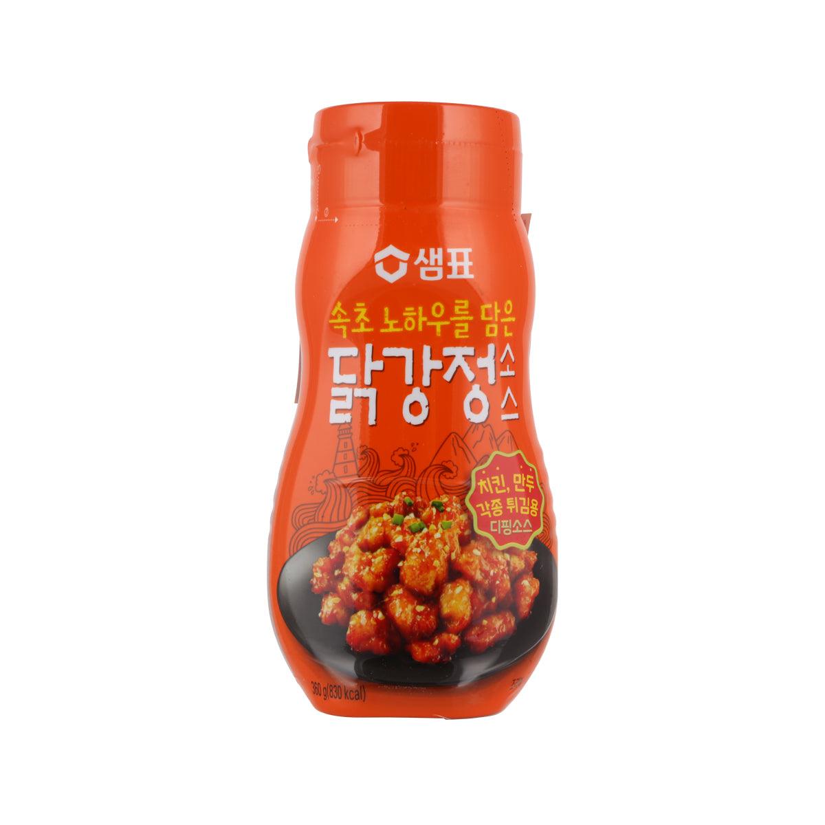 Korean fried chicken sauce bottle, orange cap, red sauce label