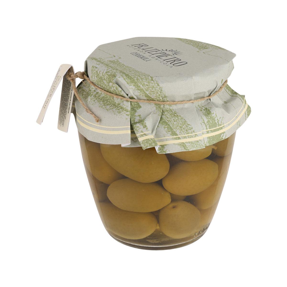 Glass jar of brined green olives with sealed paper lid and ribbon