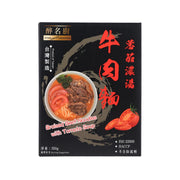 Braised beef noodles with tomato soup (550g) on black box, shown with bowl and herbs.