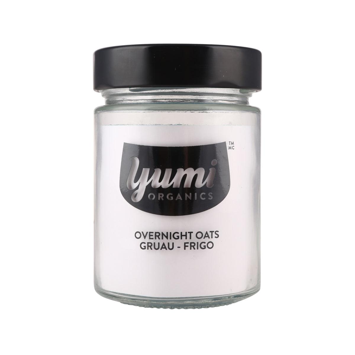 YUMI ORGANICS glass jar with black lid, label shows overnight oats