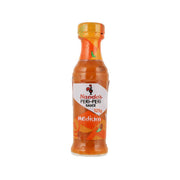 NANDO'S medium peri-peri sauce bottle, 125 g, orange bottle with red label