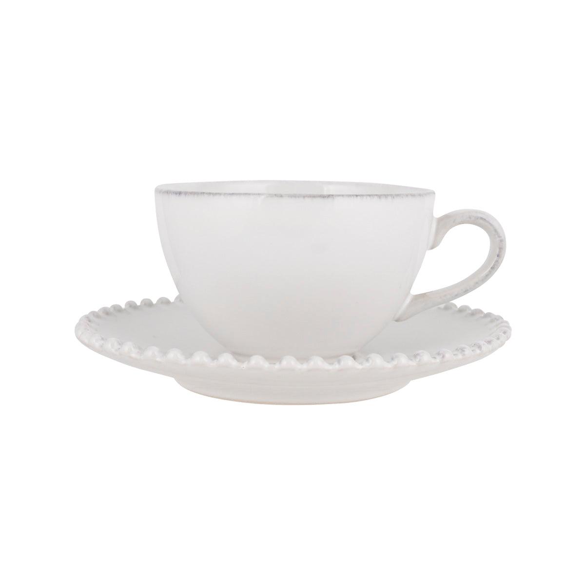 White tea cup with matching saucer, handle and scalloped rim