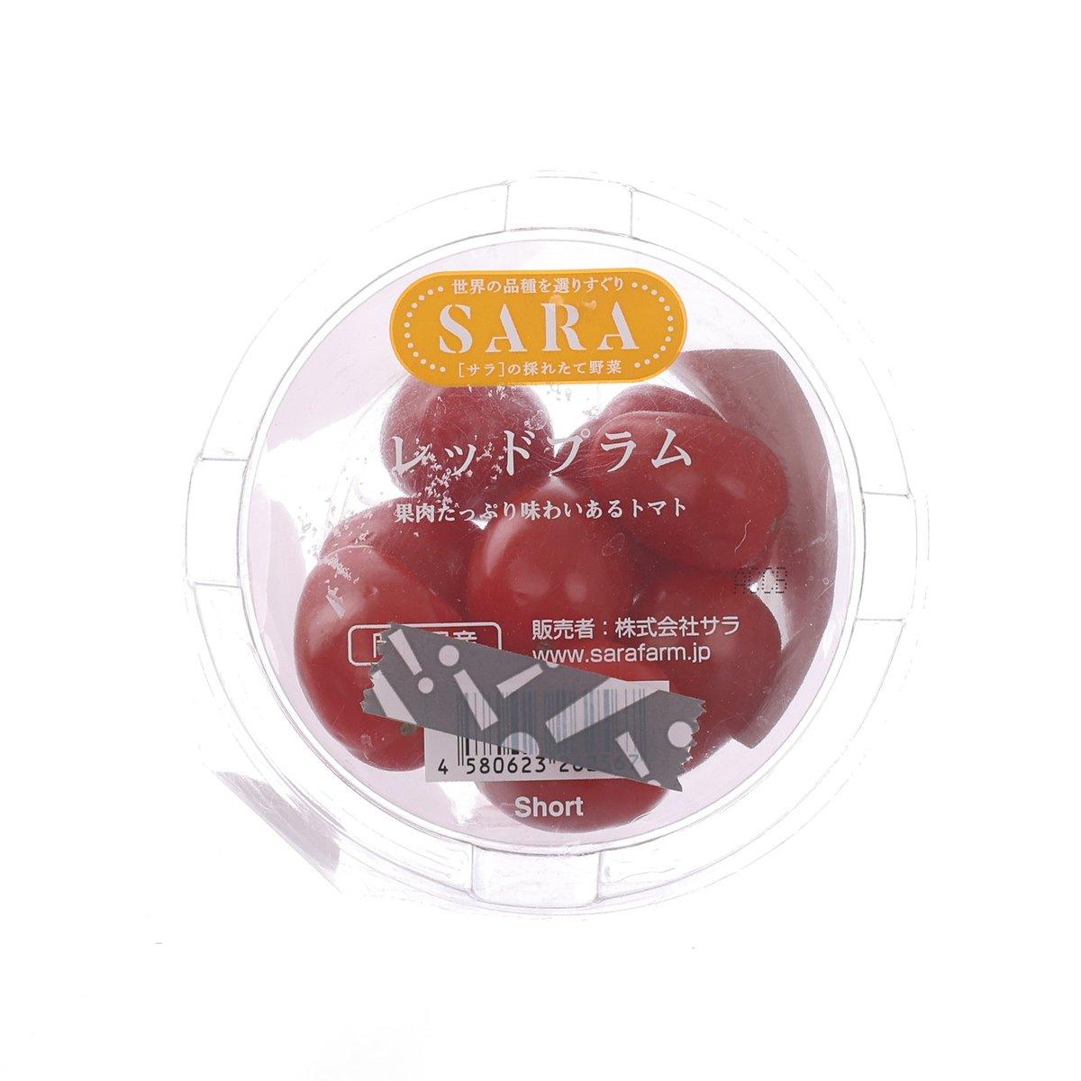 Red Japanese plum tomatoes in a clear plastic produce pack