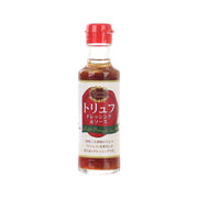 Truffle dressing sauce bottle, red cap, clear glass with amber liquid, front label