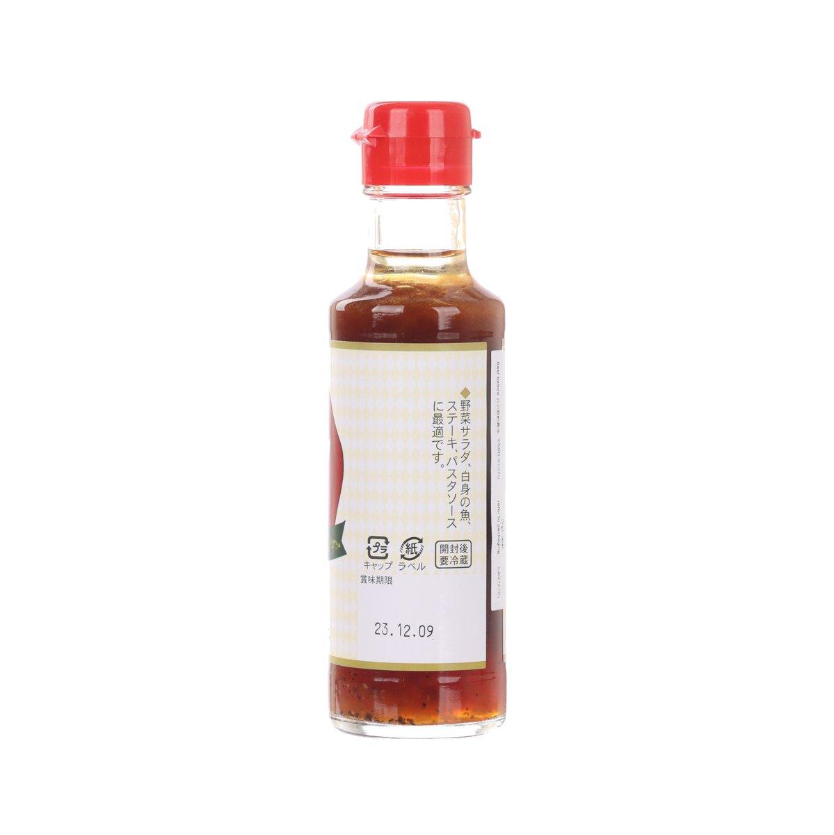 Truffle dressing sauce bottle, red cap, clear glass with amber liquid, side label