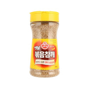 OTTOGI jar of roasted sesame seeds, yellow lid, clear view of sesame kernels