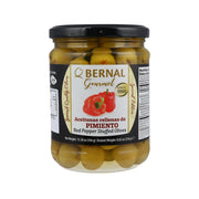 Jar of red pepper stuffed olives in brine, with black screw-top lid