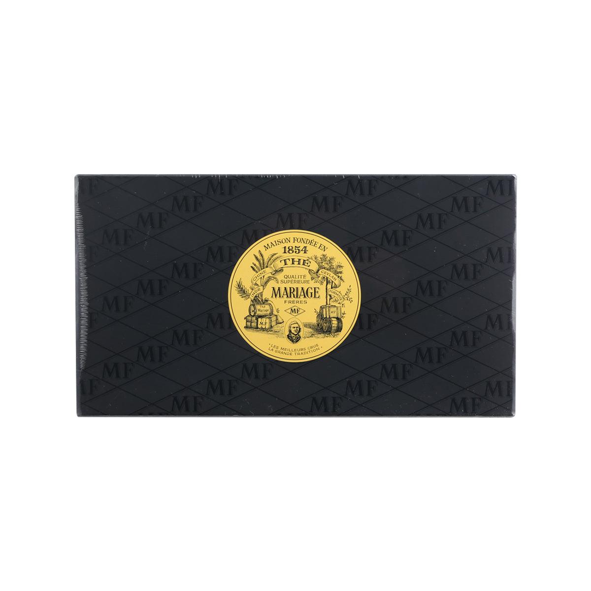 Tea gift set box, dark blue with repeating logo pattern and gold circular seal