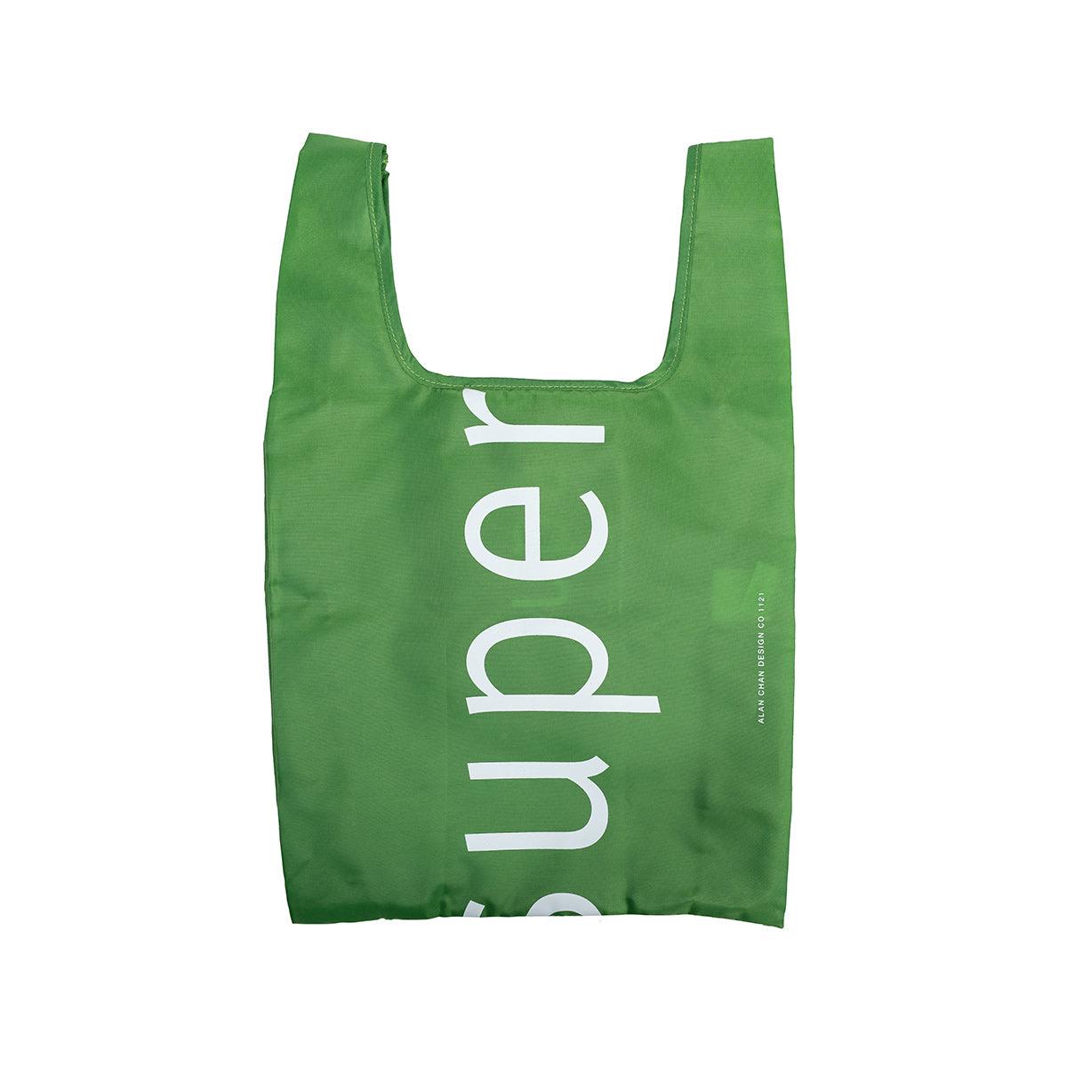 Green foldable tote bag with CITYSUPER logo print, short side handles