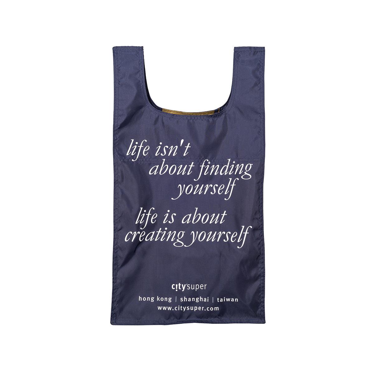 Navy reusable tote bag with front slogan and small branding label