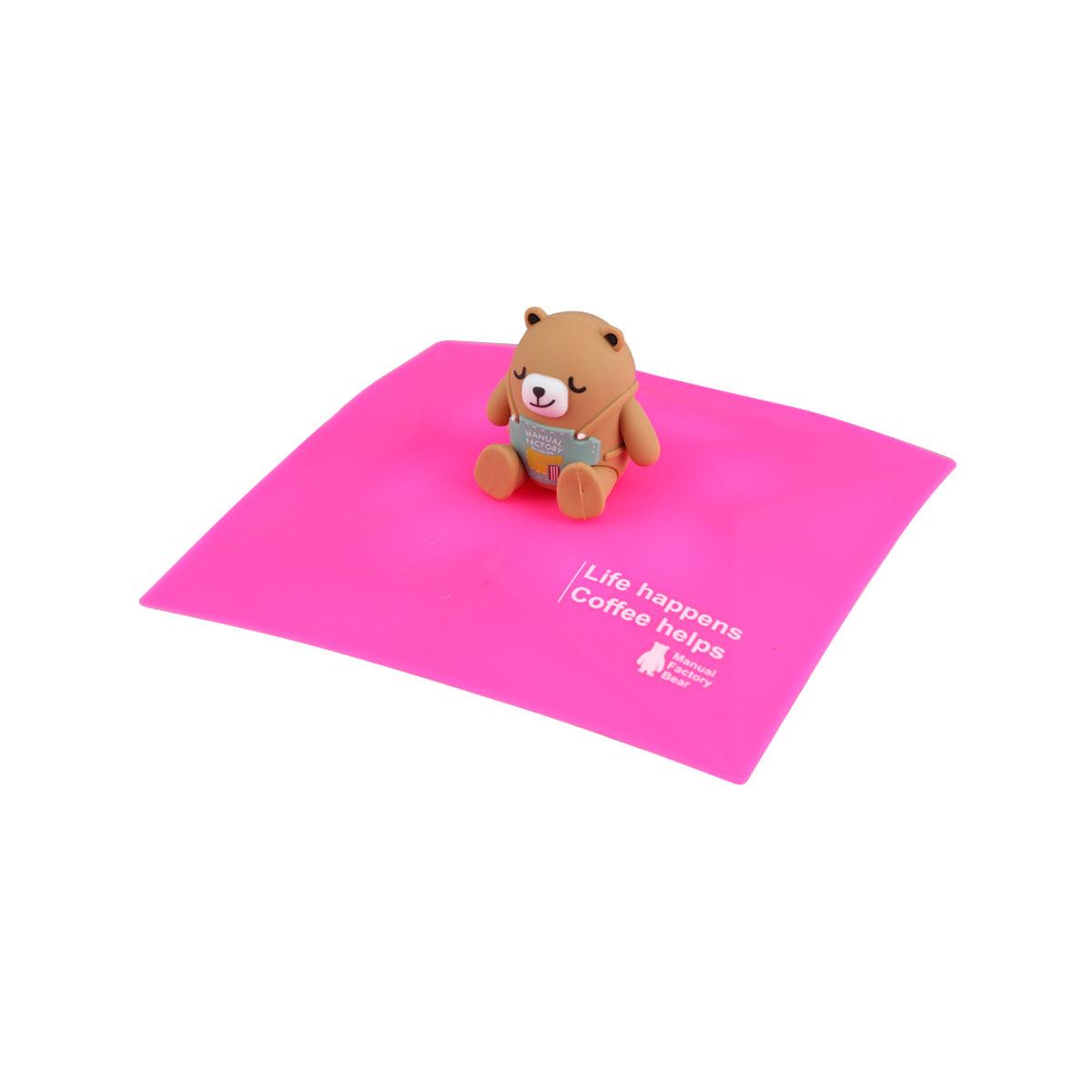 Pink square silicone cup cover with bear figurine topper centered